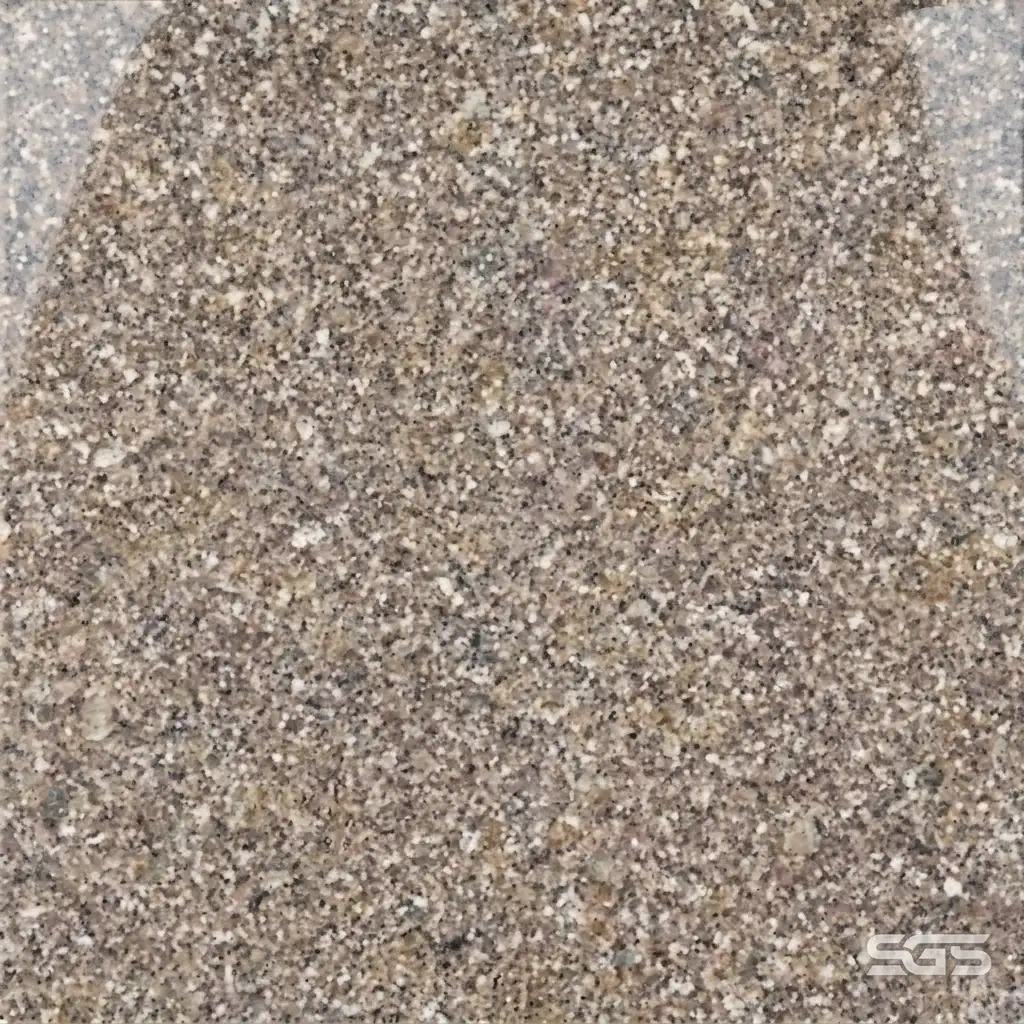 close-up texture of Adhunik Brown Granite displaying a uniform blend of brown, beige, grey, and black mineral crystals with a refined granular appearance