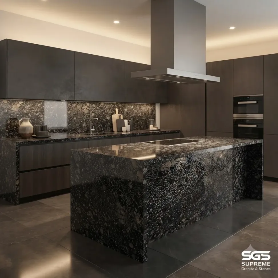 Modern kitchen featuring a Majestic Black Granite waterfall island, matching countertops, and backsplash with contrasting grey, silver, and brown mineral patterns.