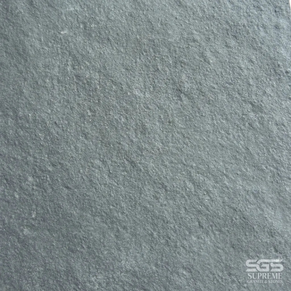Close-up texture of Natural Grey Kota Stone showing its authentic grey limestone surface with natural riven texture, suitable for flooring, patios, walkways, landscaping, wall cladding, and outdoor paving.